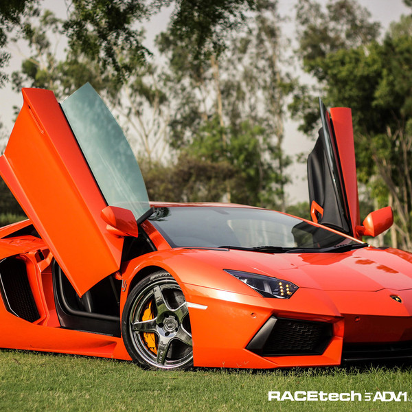 Custom Vertical Doors on Orange Lamborghini Aventador - Photo by ADV.1