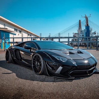Black Lamborghini Aventador Lowered on Forgiato Wheels Shod in Pirelli P-Zero Tires