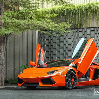 Orange Lamborghini Aventador with Vertical Doors - Photo by Vossen