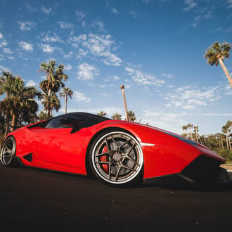 Carbon Fiber Front Lip on Red Lamborghini Huracan - Photo by Brixton Forged Wheels