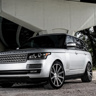 Silver Land Rover Range Rover with Aftermarket Headlights - Photo by Vossen