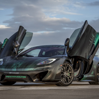 Black McLaren 12C with Vertical Doors - Photo by Vorstiner