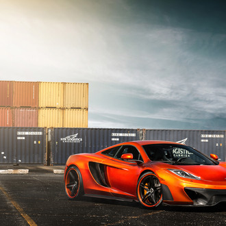 Carbon Fiber Front Bumper on Orange McLaren 12C - Photo by Vorstiner