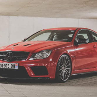 Red Mercedes C Class 6.3 with Custom Headlights - Photo by Vossen