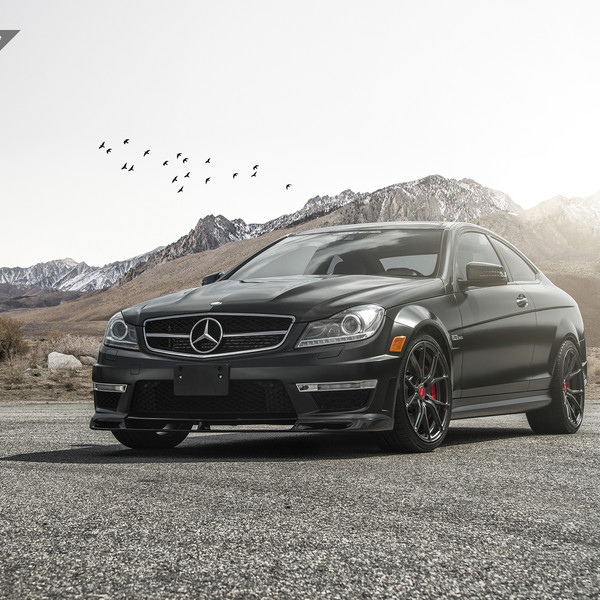 Black Mercedes C Class with Dark Smoke Headlights - Photo by Vorstiner