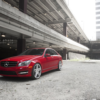 Red Mercedes C Class with Aftermarket Headlights  - Photo by zandbox