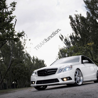 White Benz With Black Tinted Headlights and Taillights