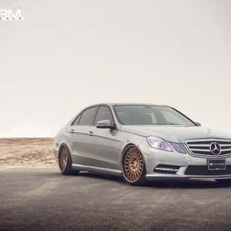 Fancy Mercedes E-Class with Solid Gray Exterior Color and Chrome Grille