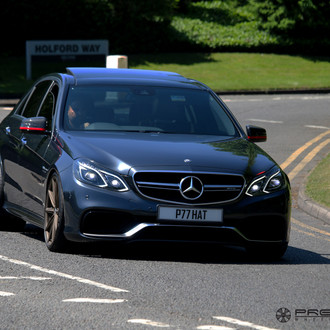 Gloss Black Mercedes E Class with Aftermarket Headlights - Photo by Vossen