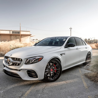 Aftermarket Projector Headlights on White Mercedes E Class - Photo by Vorsteiner