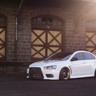 White Stanced Mitsubishi Evolution with Custom Hood - Photo by Avant Garde Wheels