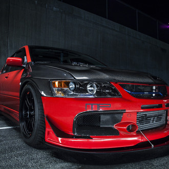 Transformed Red Mitsubishi Evolution Gets Carbon Fiber