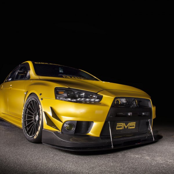 Yellow Mitsubishi Evolution with Carbon Fiber Front Lip - Photo by Manuel Veron