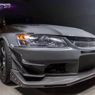 Gray Mitsubishi Evolution with Custom Projector Headlights  - Photo by Manuel veron