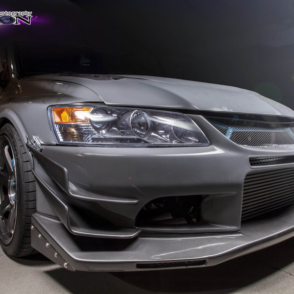 Gray Mitsubishi Evolution with Custom Projector Headlights - Photo by Manuel veron