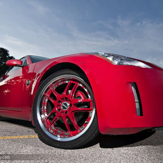 Aftermarket Front Bumper on Red Nissan 350Z - Photo by dan kinzie