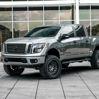 Silver Nissan Titan with Aftermarket Projector Headlights - Photo by Black Rhino Wheels