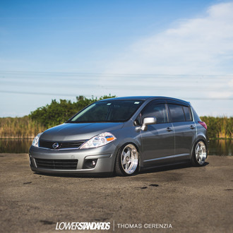Gray Nissan Versa with Aftermarket Headlights - Photo by Avant Garde Wheels