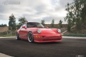 Matte Black Avant Garde Wheels Adorning Red Porsche 911