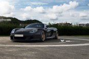 Bossy and Awesome Black Porsche Carrera GT on Custom Rims