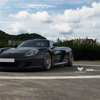 Black Porsche Carrera GT with Aftermarket Halo Headlights - Photo by ADV.1