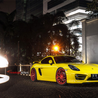 Bright Yellow Porsche Cayman Sitting Low on ADV.1 Custom Wheels - Photo by ADV.1