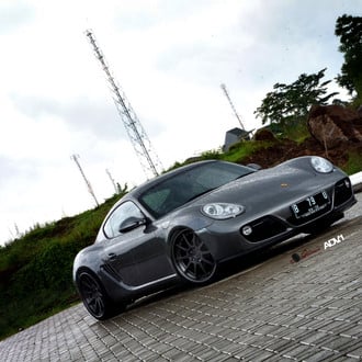 Black Porsche Cayman with Custom Front Bumper - Photo by ADV.1