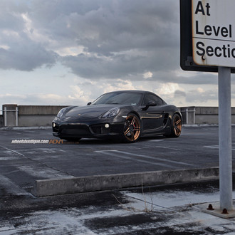 Dark Smoke Headlights on Black Porsche Cayman - Photo by ADV.1