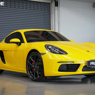 Yellow Porsche Cayman with Aftermarket Front Bumper - Photo by Vorstiner
