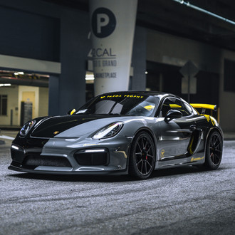 Custom Black Porsche Cayman with Yellow Accents - Photo by Forgeline Motorsports