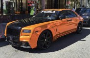 Distinctive Blacked Out Billet Grille on Orange Rolls Royce Ghost