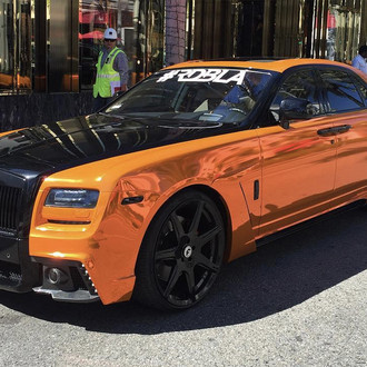Orange Rolls Royce Ghost with Blacked Out Billet Grille - Photo by Forgiato