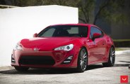 Apple Red Red Scion FRS Showing Off Crystal Clear Headlights and Chrome Rims