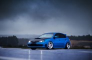 Blue Subaru Impreza Showing Off Custom Hood with Air Vent