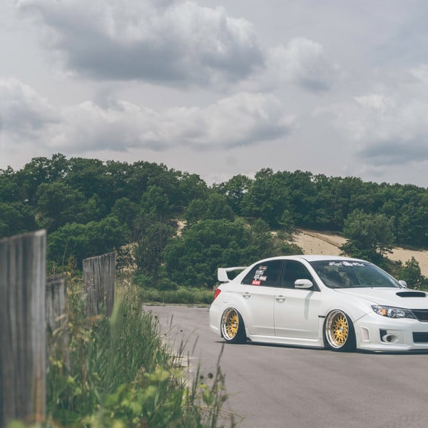 Custom White Stanced Debadged Subaru WRX - Photo by Avant Garde Wheels