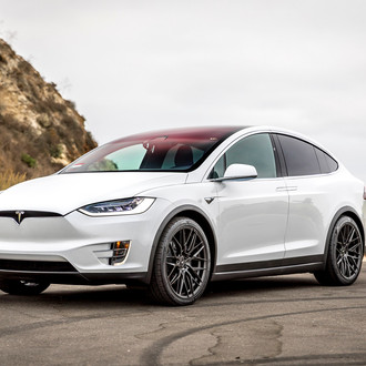 Front Bumper with Fog Lights on White Tesla Model X - Photo by Vorstiner