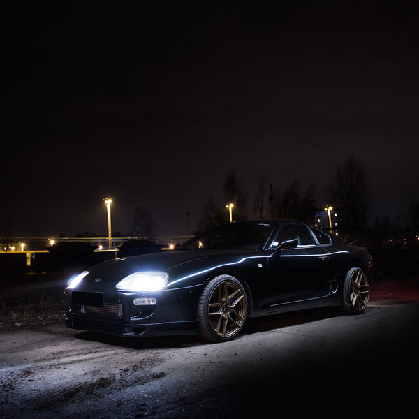 Black Toyota Supra with Aftermarket Crystal Clear Headlights - Photo by JR Wheels