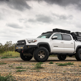 Front Bumper with LED Light Bars on White Toyota Tacoma - Photo by Black Rhino Wheels