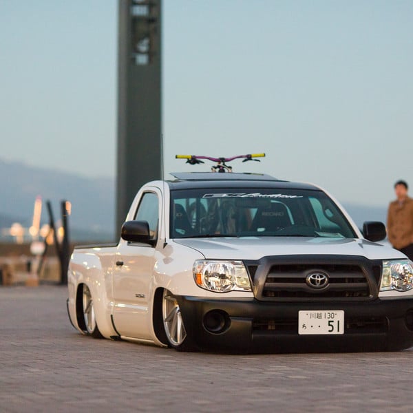 Custom Lowered Toyota Tacoma with Black Grille - Photo by Vossen