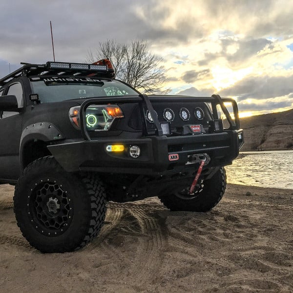 Black Lifted Toyota Tacoma with ARB Front Winch Bumper - Photo by TSW Alloy Wheels