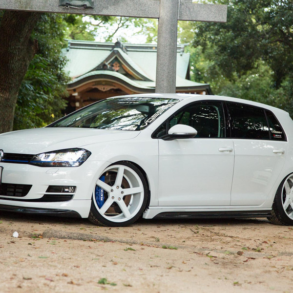 White VW Golf with Carbon Fiber Front Lip - Photo by Vossen