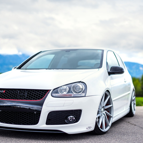 Blacked Out Grille with Red Accents on VW Golf - Photo by Vossen