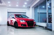 Hyper Black JR Wheels and Blacked Out Mesh Grille Contrast Greatly with Red VW Golf GTI