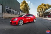 Revised Front End of Bright Red VW Golf on Custom Wheels