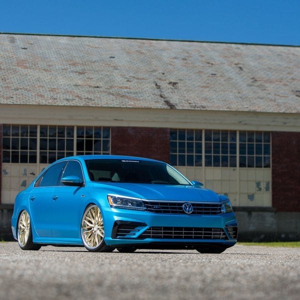 Slammed Passat On Gold Vossen Rims with Polished Wheels - Photo by Vossen