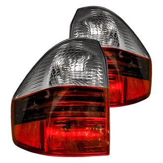 Replacement - Driver and Passenger Side Outer Tail Light Lens and Housing Set (Standard Line)