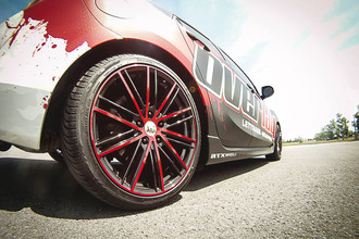 Strobe 5 Gloss Black Red Accents on Car
